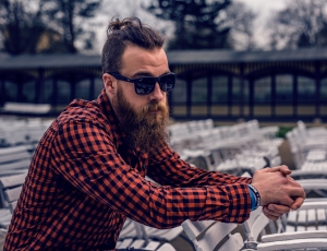 man in orange and black plaid long sleeve shirt with sunglasses thumbnail